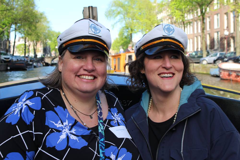 two women smile on boat tour